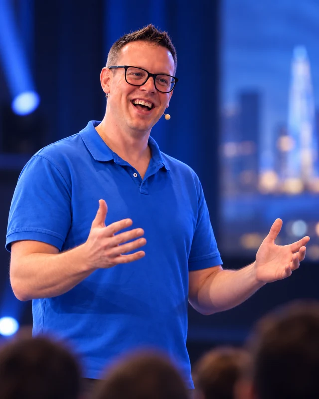 Marc Moeller presenting, wearing a headset microphone